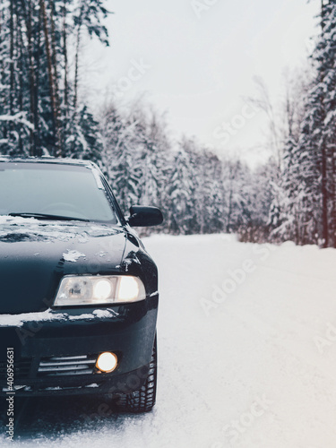 Car on winter snow road in coniferous forest © pavelkant