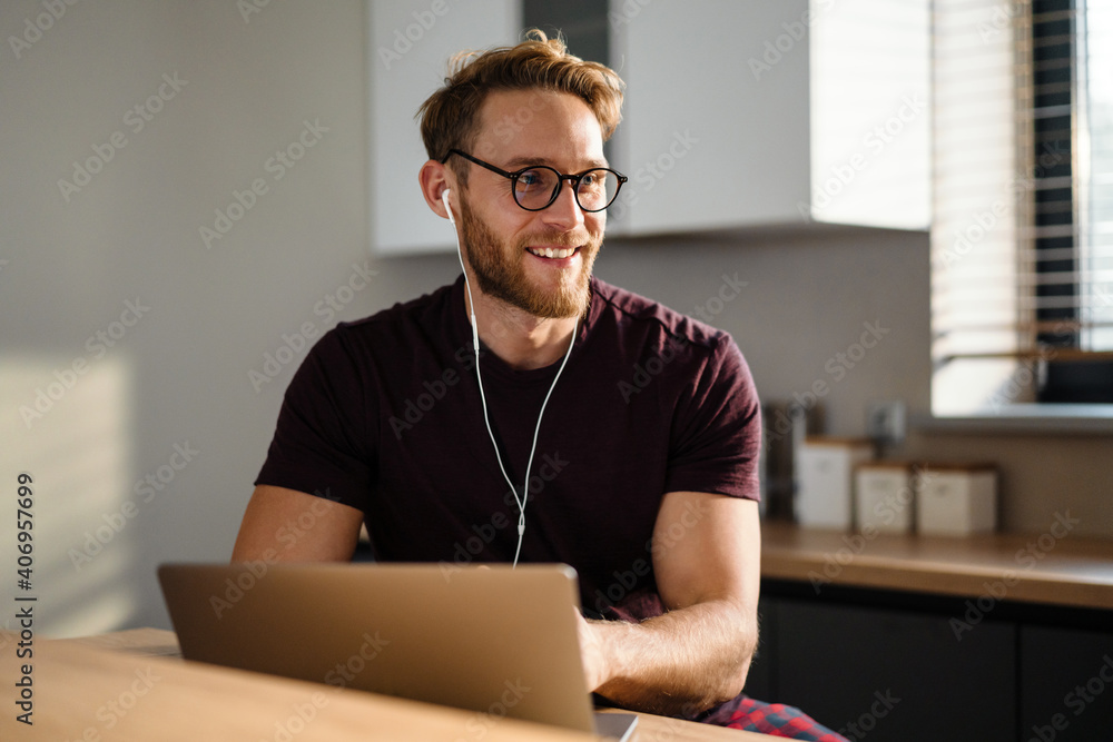 Young man working remotely and heaving a meeting Young man working remotely and heaving a meeting