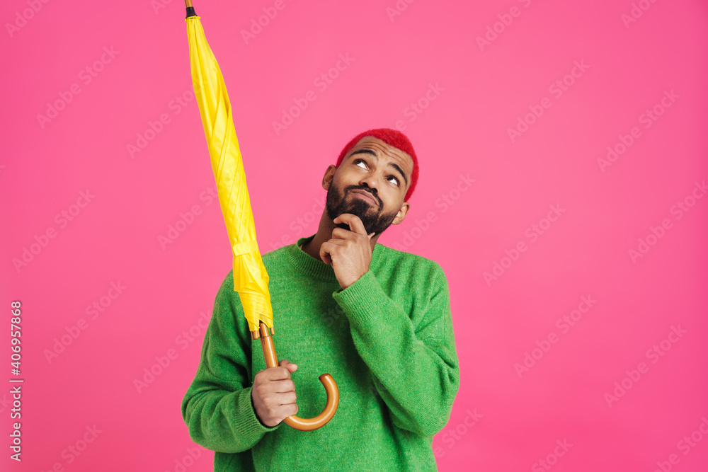Joyful african american guy smiling while posing Joyful african american guy smiling while posing