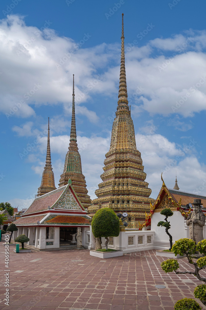 Beautiful stupas decorated with colorful mosaic at pagoda is Thai art architecture of Wat Pho temple is famous place and travel attraction in Bangkok, Thailand.