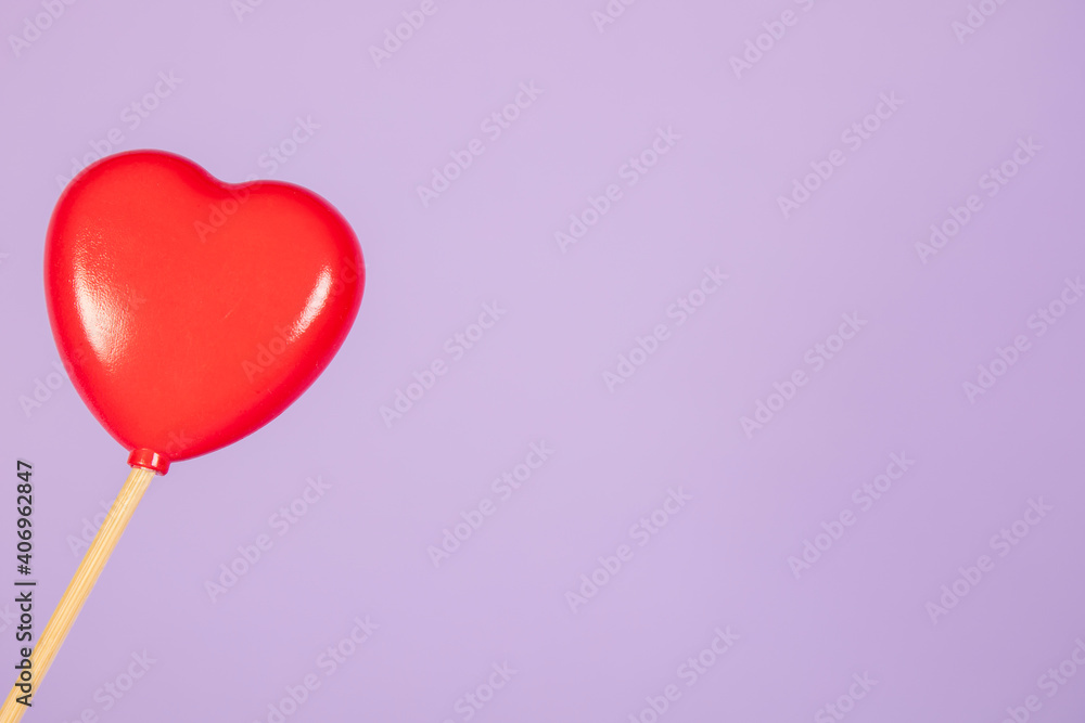 lonely heart over purple background, copy space 