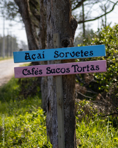 BALNEÁRIO GAIVOTA, SANTA CATARINA, BRAZIL - DECEMBER 11, 2020: View of a sign in the Village Dunas district with the following message: açaí ice cream, coffee juices and pies.