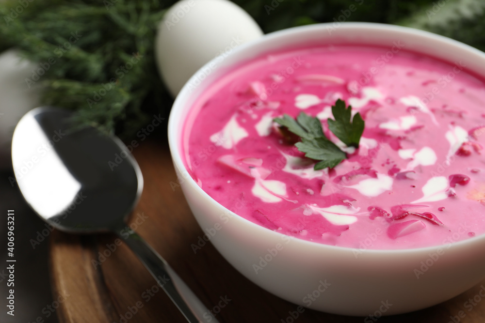 Delicious cold summer beet soup on wooden board, closeup Delicious cold summer beet soup on wooden board, closeup