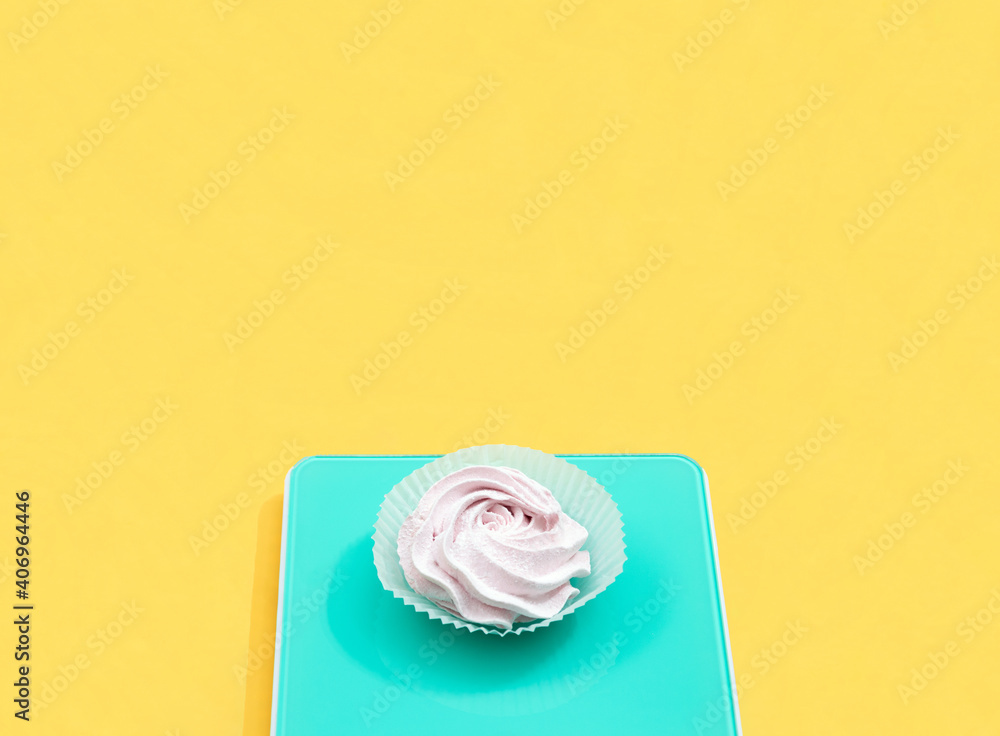 On a yellow background, marshmallows in a package. Space for text. On a yellow background, marshmallows in a package. Space for text.