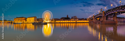 Ferris wheel and bridge over the river