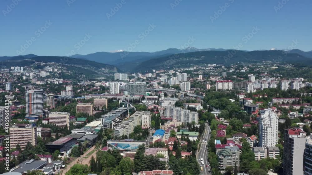 Aerial video shooting. Panoramic bird's-eye view of the city center of Sochi. Clear sunny day. background of high mountains. Dense building. Aerial video shooting. Panoramic bird's-eye view of the city center of Sochi. Clear sunny day. background of high mountains. Dense building.