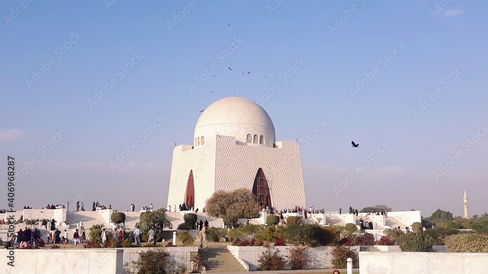 Karachi, Pakistan – January 25, 2020: The beautiful landscape of the tomb of the Quaid‐e‐Azam with blue sky. Mausoleum of Jinnah. Jinnah mausoleum. mazar-e-quaid. Quaid-e-azam