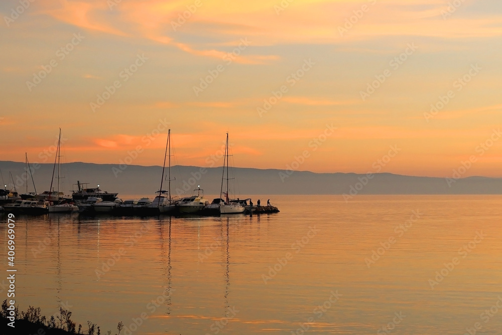 Dock with various small boats and beautiful sunset. Landscape in Split, Croatia. Dock with various small boats and beautiful sunset. Landscape in Split, Croatia.