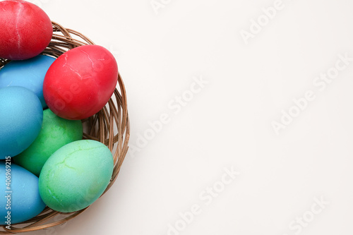 Easter eggs on a blue table with copy space