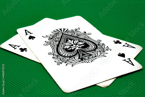 Photography Two aces on green poker table
