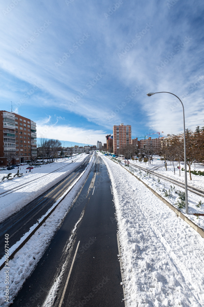 View from a bridge of the A2 highway with snow, direction Madrid, a sunny day, Madrid, Spain, Europe, January 10, 2021, vertical