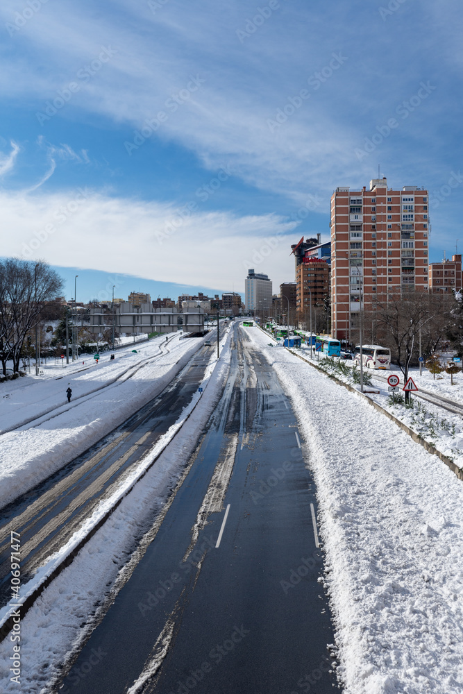 View from a bridge of the A2 highway with snow, a sunny day, Madrid, Spain, Europe, January 10, 2021, vertical