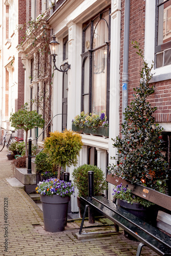 Fototapeta Naklejka Na Ścianę i Meble -  Flower filled window boxes. Urban gardening landscaping design. Amsterdam