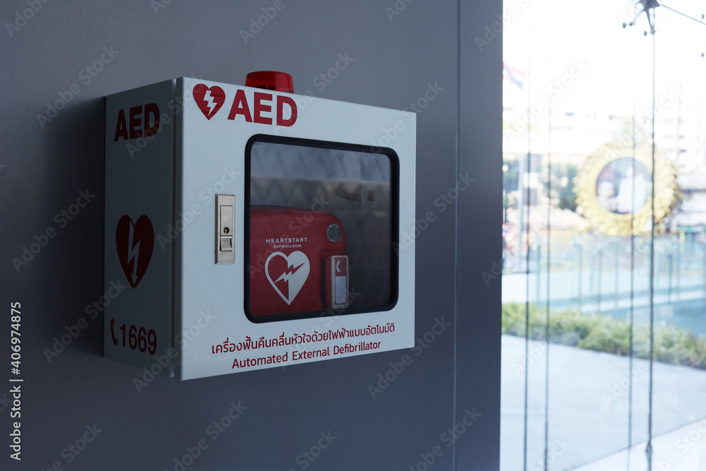 Heart defibrillator in white box on the wall with Thai word mean