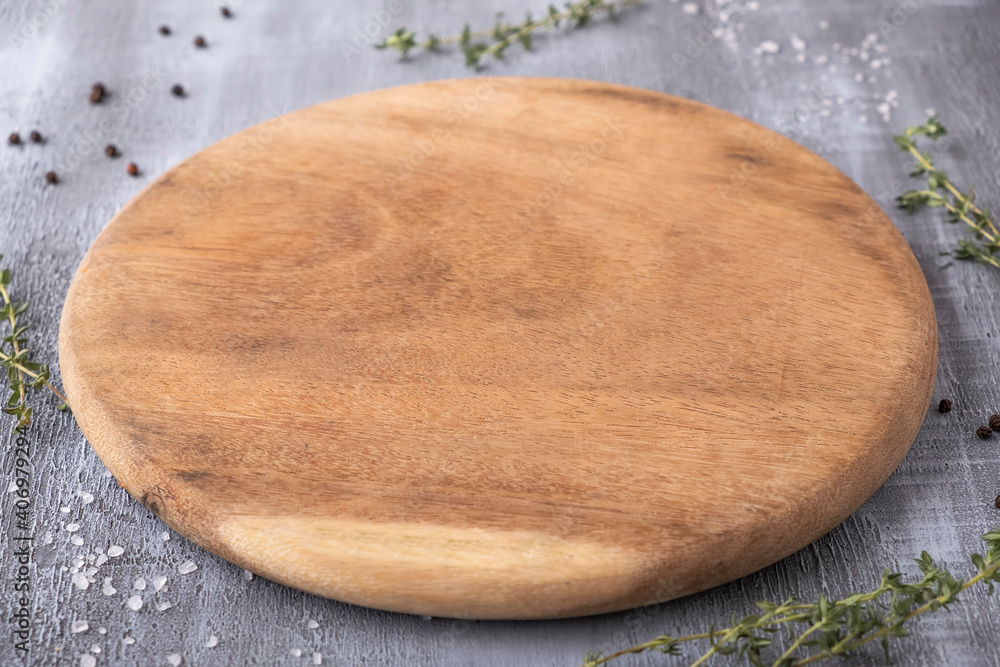 Empty round wooden board with spices. Empty round wooden board with spices.