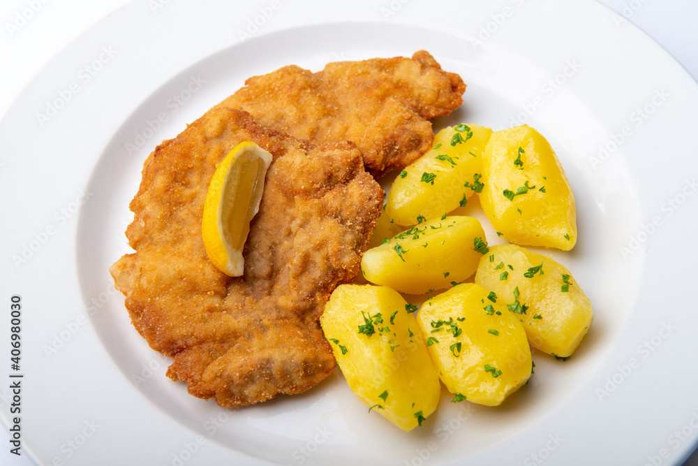 Pork chop with parsley potatoes and lemon Pork chop with parsley potatoes and lemon