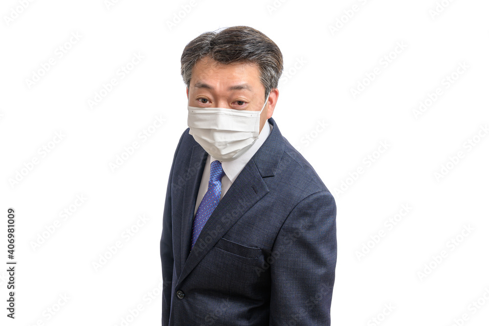 Portrait of a middle-aged Asian businessman wearing a white face mask. White Background. Covid19, Health, and Business Concepts. Portrait of a middle-aged Asian businessman wearing a white face mask. White Background. Covid19, Health, and Business Concepts.