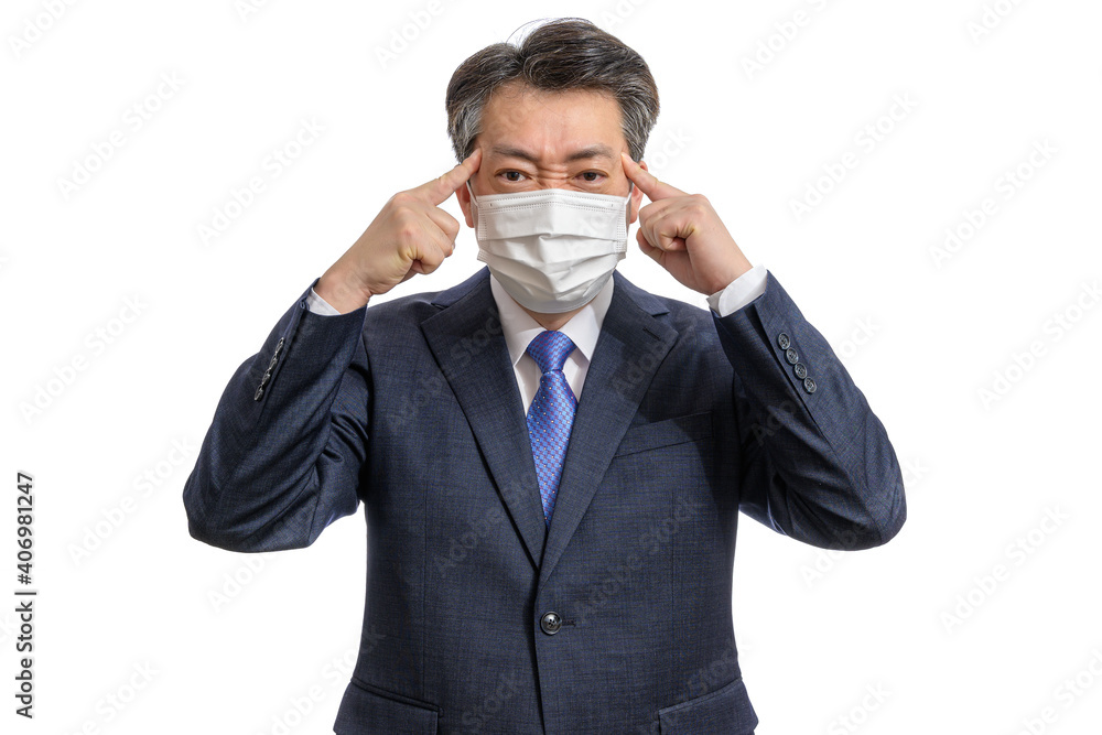 Portrait of a middle-aged Asian businessman wearing a white face mask. White Background. Covid19, Health, and Business Concepts. Portrait of a middle-aged Asian businessman wearing a white face mask. White Background. Covid19, Health, and Business Concepts.