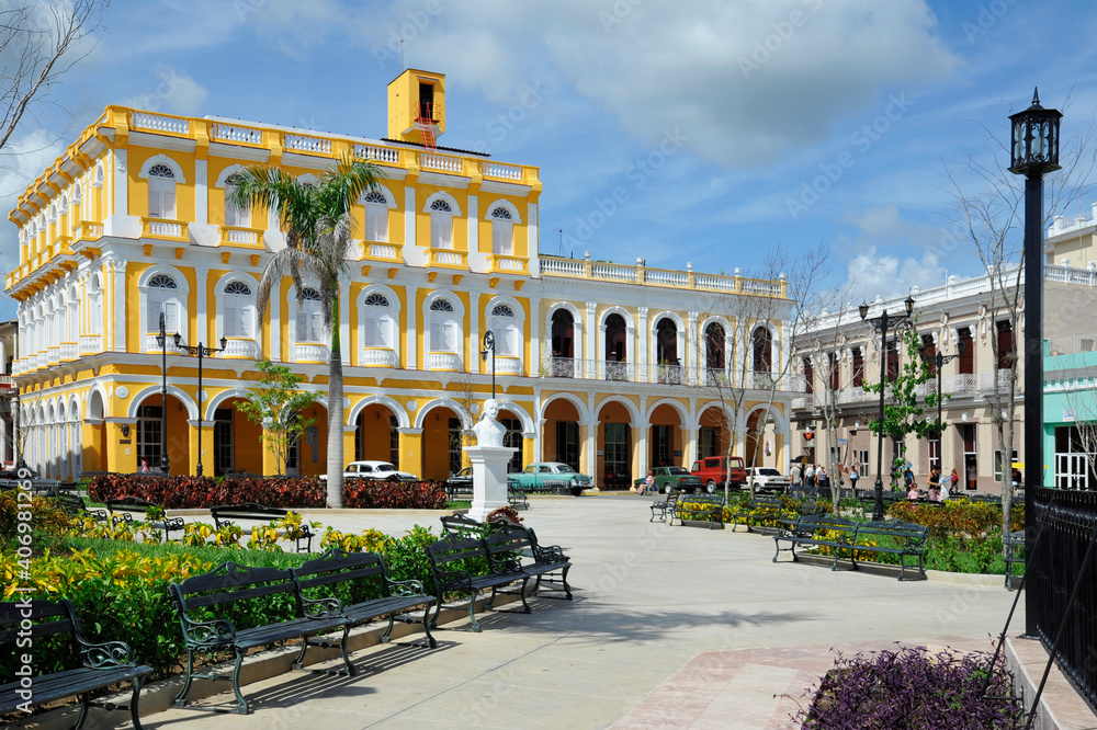 Colorful colonial buildings surrounding Serafin Sanchez Park and main square in the city and municipality of the province with the same name in central Cuba, in Sancti Spiritus