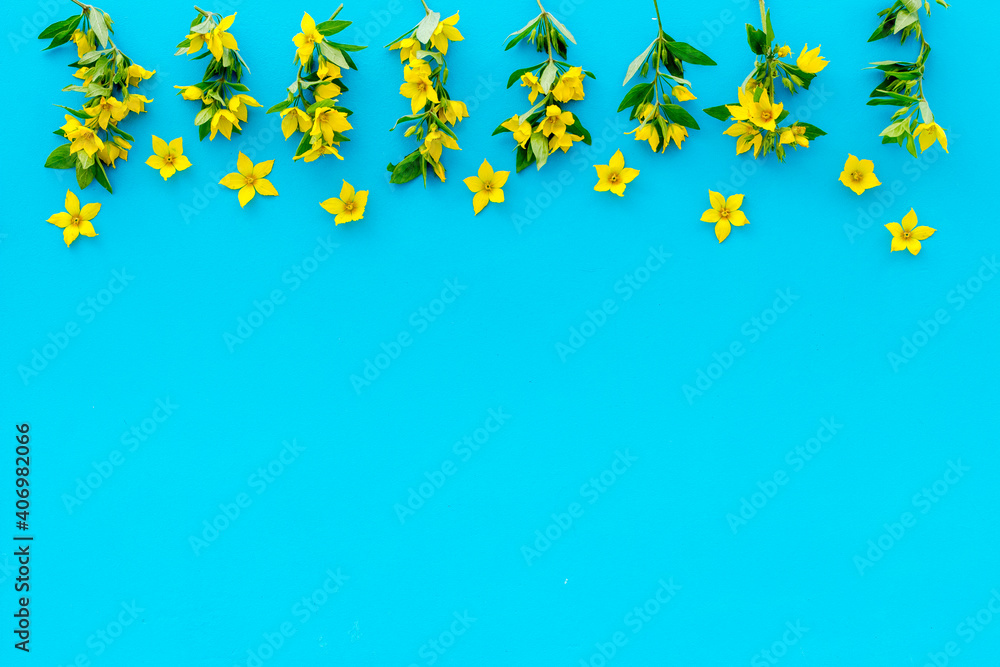 Flowers pattern. Flat lay of yellow flowers with leaves, top view