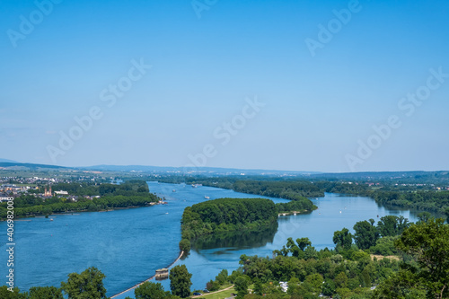 View over the majestically flowing river Rhine with an island near Bingen / Germany
