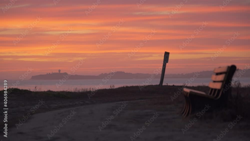 Astonishing sunset and a bench in the foreground, Half Moon Bay. Astonishing sunset and a bench in the foreground, Half Moon Bay.