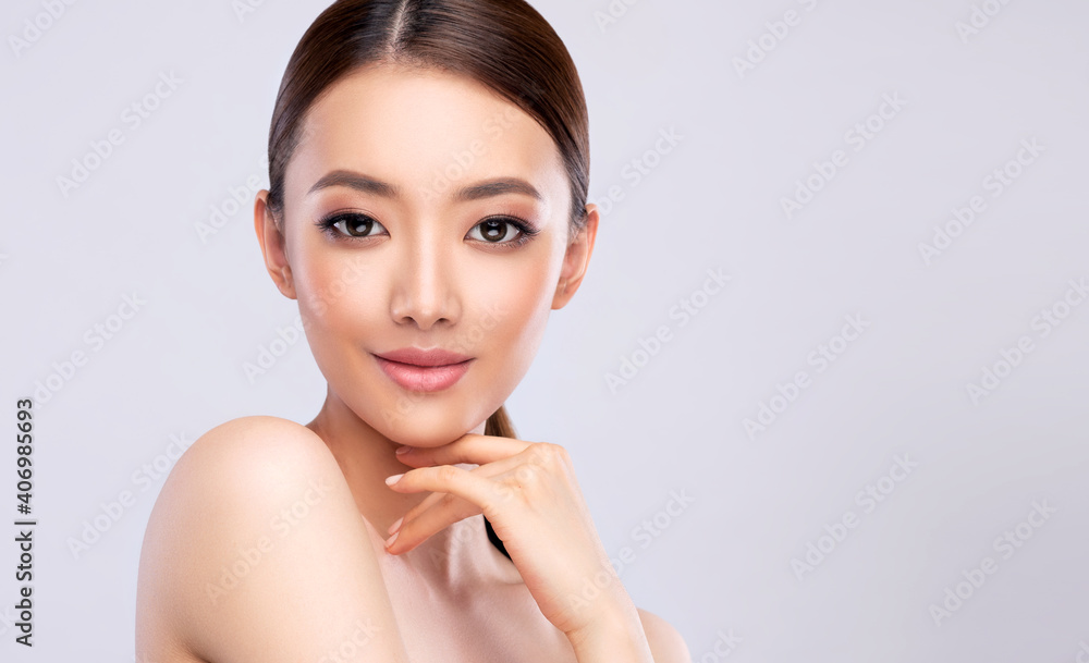 Beautiful young asian woman with Clean Fresh Skin on face . Chinese girl Facial treatment . Cosmetology , beauty and spa . Beautiful young asian woman with Clean Fresh Skin on face . Chinese girl Facial treatment . Cosmetology , beauty and spa .