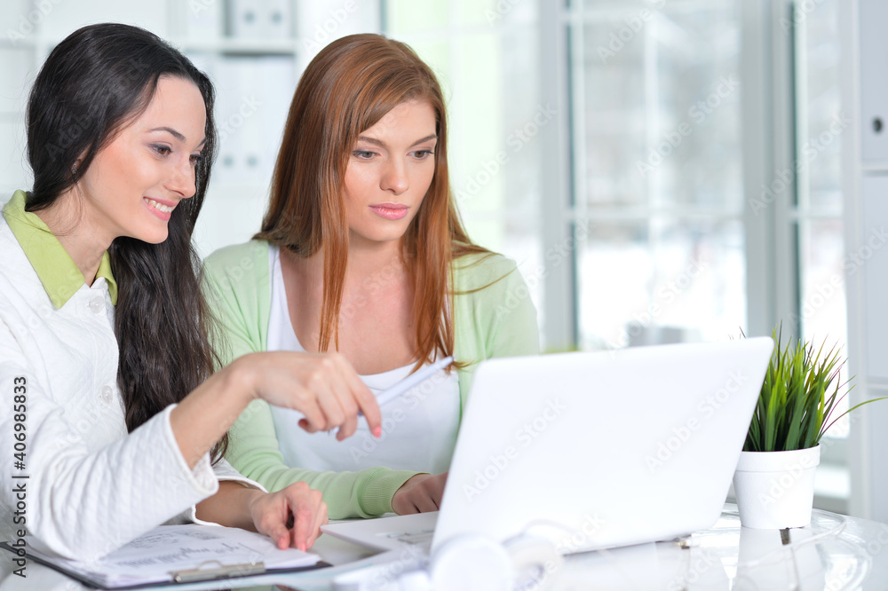 young businesswomen working in modern office young businesswomen working in modern office