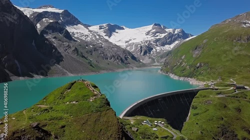 Flight over of Kaprun high mountain reservoirs Mooserboden Stausee in the Hohe Tauern, Salzburger land, Austria. photo