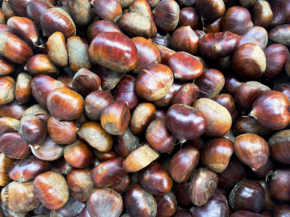 Chestnuts on the market. Photo of nuts on harvest festival. Overhead view Chestnuts on the market. Photo of nuts on harvest festival. Overhead view