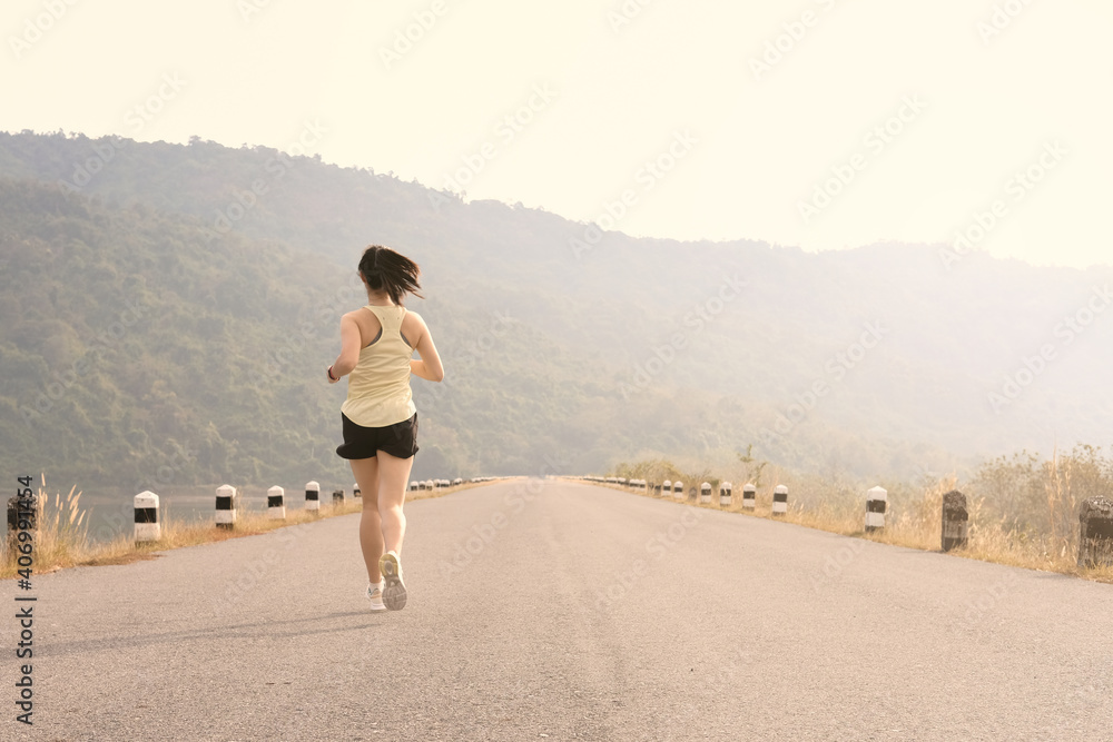 Empty road with running girl in background