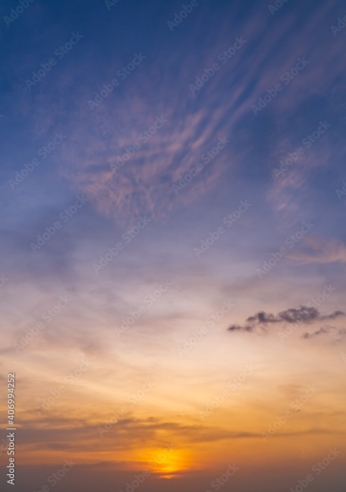 Sunset sky in the evening on twilight with orange and purple sunlight sky nature background,Dusk sky vertical.  