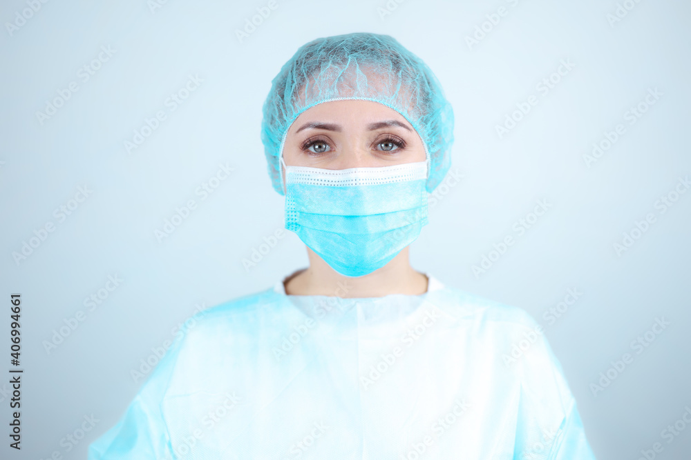 Nurse in a medical gown, mask on a white background Nurse in a medical gown, mask on a white background