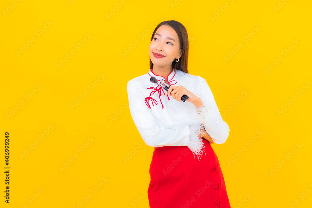 Portrait beautiful young asian woman with make up brush Portrait beautiful young asian woman with make up brush