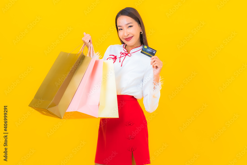 Portrait beautiful young asian woman with shopping bag and credit card Portrait beautiful young asian woman with shopping bag and credit card