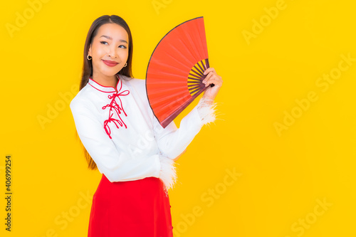 Portrait beautiful young asian woman with red envelopes letter © siraphol