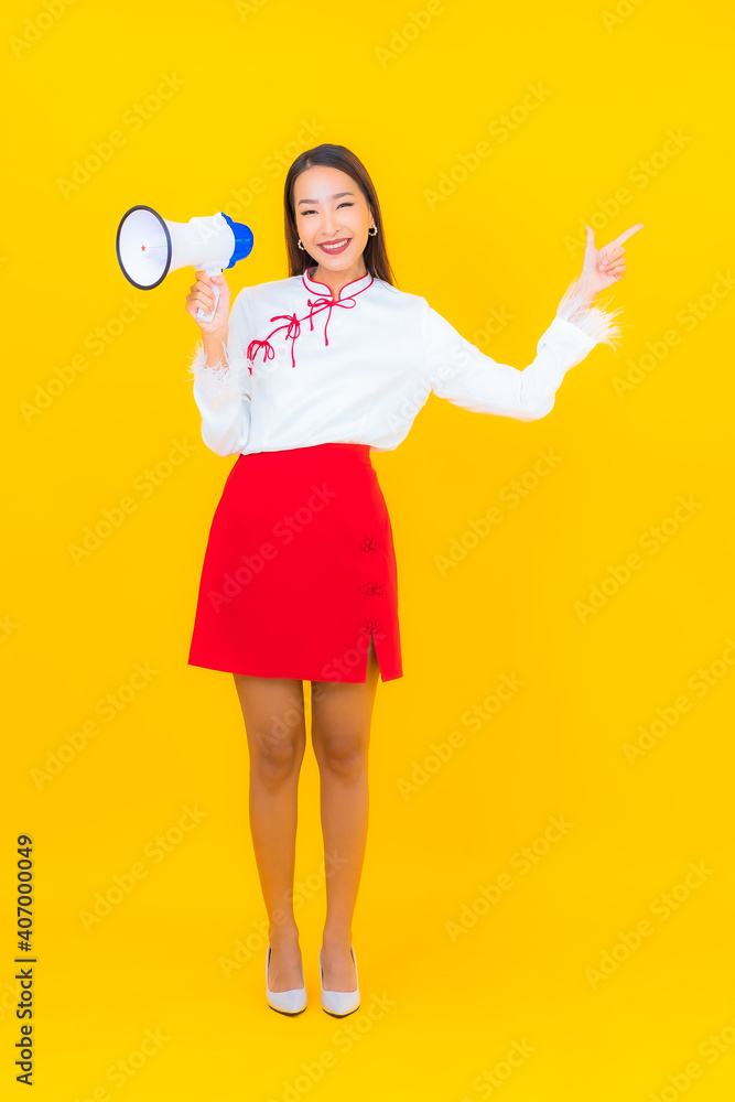 Portrait beautiful young asian woman use megaphone Portrait beautiful young asian woman use megaphone