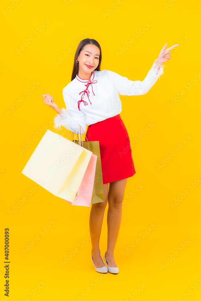 Portrait beautiful young asian woman with shopping bag and credit card Portrait beautiful young asian woman with shopping bag and credit card