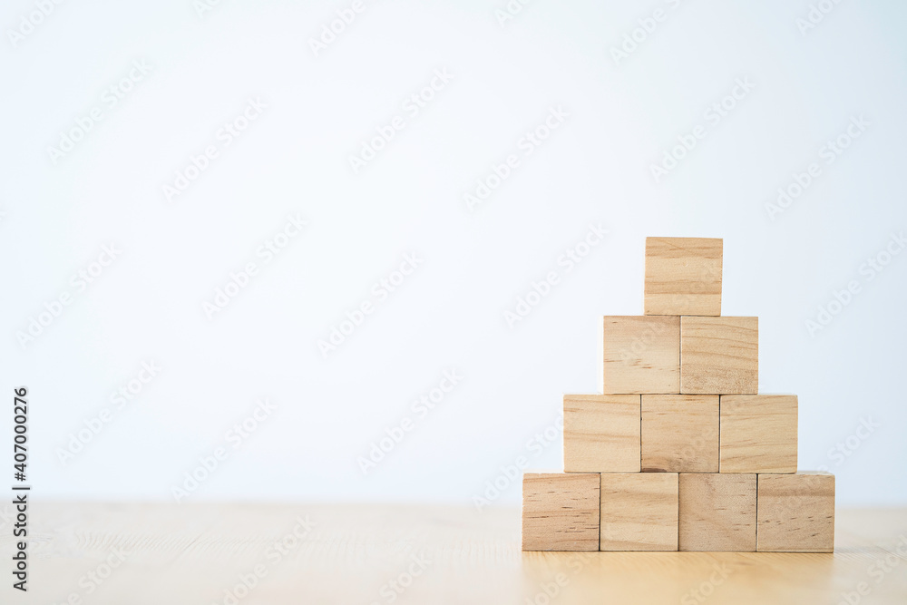 stacking of blank wooden cubes on table with copy space for input wording and infographic icon.