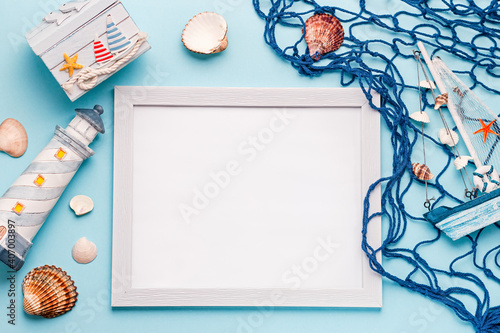 Summer travel concept flat lay with mock up frame on blue  top view