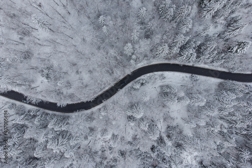 Aerial winter view of the curvy mountain road, in Poiana Brasov