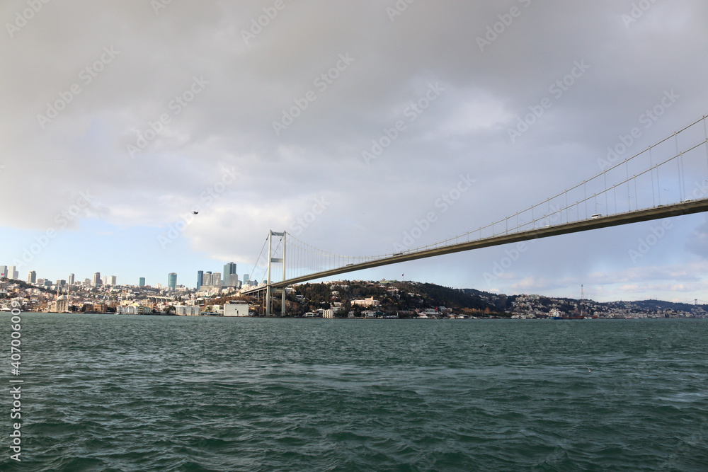 The Bosphorus Bridge, thus connecting Europe and Asia (alongside Fatih Sultan Mehmet Bridge and Yavuz Sultan Selim Bridge). The bridge extends between Ortaköy (in Europe) and Beylerbeyi (in Asia). The Bosphorus Bridge, thus connecting Europe and Asia (alongside Fatih Sultan Mehmet Bridge and Yavuz Sultan Selim Bridge). The bridge extends between Ortaköy (in Europe) and Beylerbeyi (in Asia).