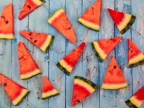Watermelon slice  on a blue rustic wood background