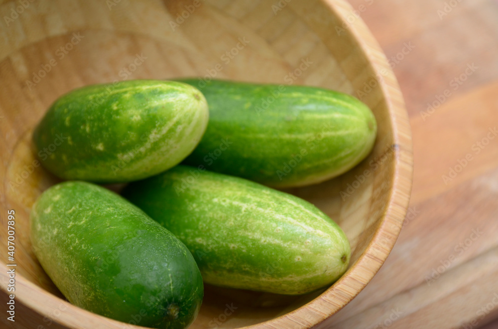 cucumbers on a wooden table cucumbers on a wooden table