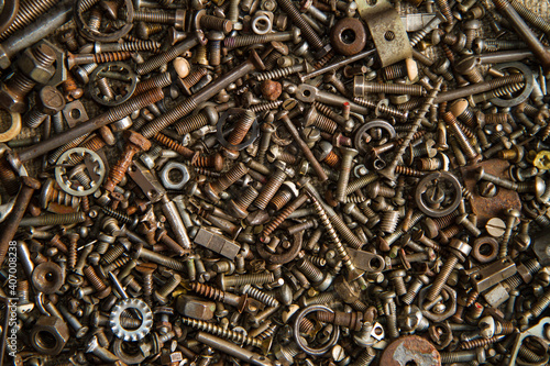 Industrial background texture. Bolts nuts washers screws and other small parts were used.