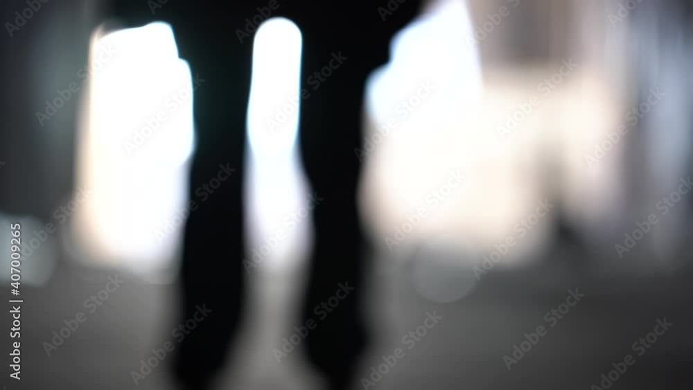 Male silhouette going to bright light. Man  in underground go to the future. Male' foot go to light. The shadows of the feet walk to light. Exit and depression concept.