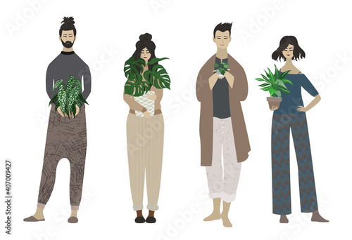 Group of young people holding potted plants