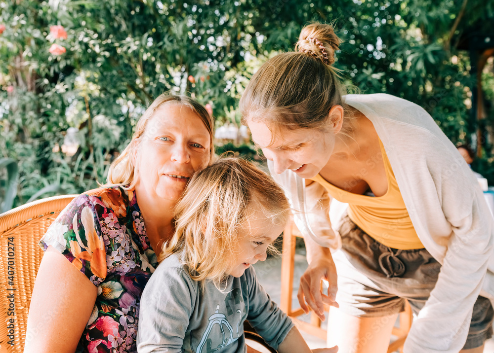 Naklejka premium Toddler girl with mother and grandmother - Cirali, Antalya Province, Turkey