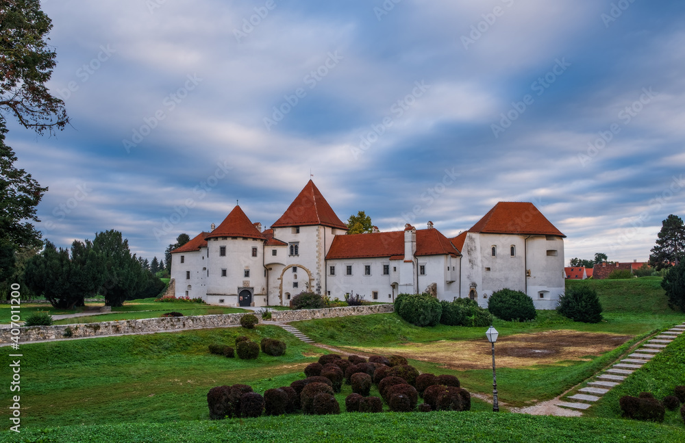 Sunrise at city park and old castle in Varazdin city, Croatia. September cloudy morning, 2020