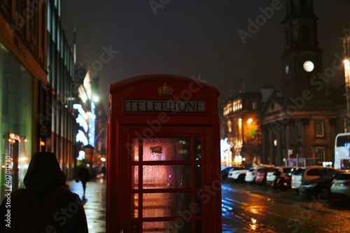 red telephone box at night